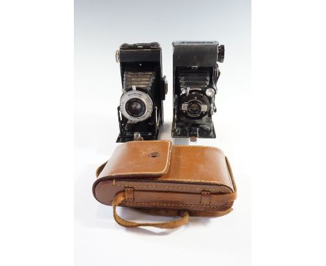 A Kershaw Eight-20 Penguin folding rollfilm camera together with a similar Brownie Six-20