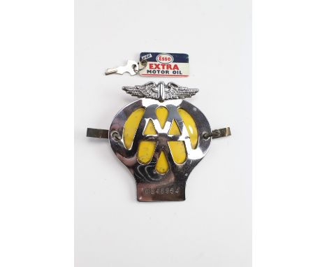 An AA car badge 6E46954 together with an Esso key ring