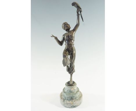 An Art Deco style cast alloy sculpture of a dancer holding a parrot aloft, on terraced marble socle, 39.5 cm 