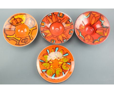 A Poole Pottery Delphis plate, shape number 4A, together with three bowls, shape number 76, former 25.5 cm