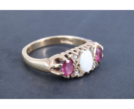 An opal, ruby and diamond finger ring, the central 6 x 4 mm opal cabochon set between two crosses each set with two eight cut