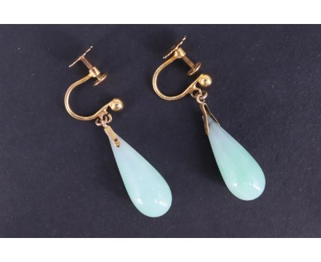 A pair of vintage jade pendant earrings, each having a teardrop shaped jade dependant from a pelleted 9 ct yellow metal screw