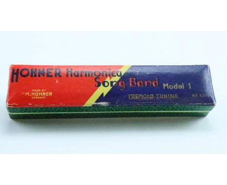 A vintage Hohner Song Band Model 1 harmonica in original carton