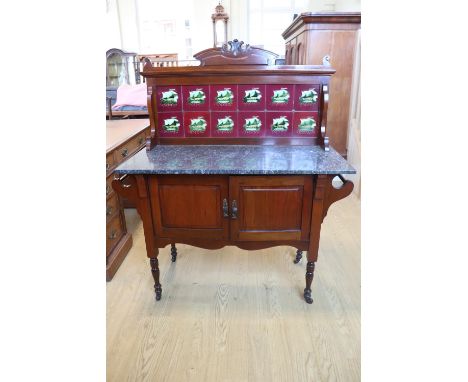 An early 20th Century walnut mirror back dressing chest, and conforming tile backed marble top washstand, former 107 x 50 x 1