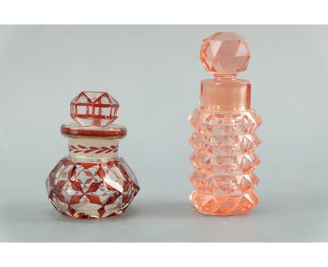 Two Victorian scent bottles, each having ground a glass stopper, one cut and ruby flashed, tallest 8.5 cm