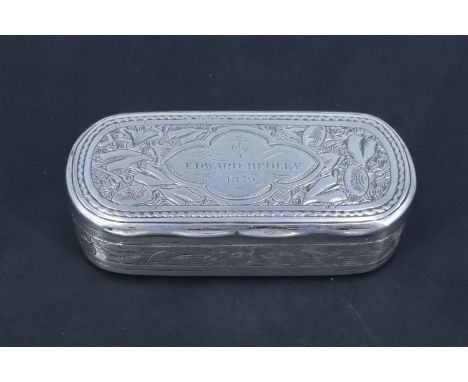 A Victorian silver snuff box, the exterior profusely decorated with gothic influenced engraving, the top having a cartouche e