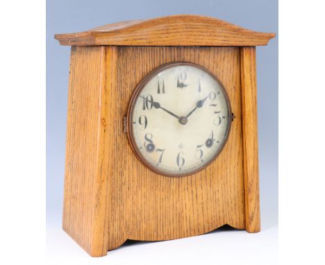 An American L Gilbert Clock Company oak cased arts and crafts influenced mantle clock, striking on a gong, 26 x 27 x 13 cm, (