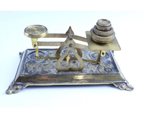 A set of early 20th Century cast brass postal scales, and a cast brass ink standish, (later inkwell insert), scales 22 x 13.5
