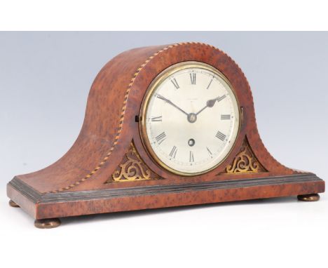 A George V burr walnut mantle clock, having a drum movement with a platform escapement, its silvered dial marked 'H Lee and S