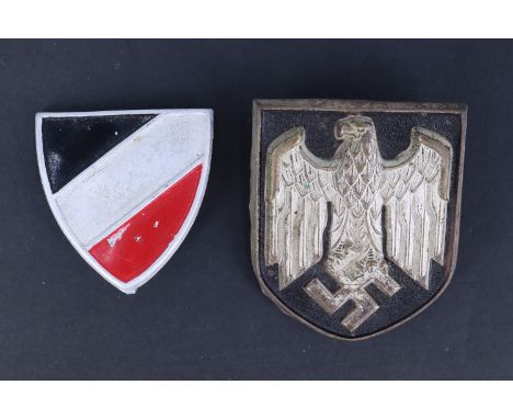 A German Third Reich army tropical helmet national emblem badge together with a similar smaller shield in national colours