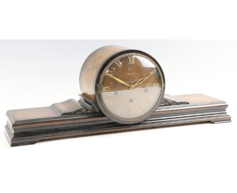 A 1940s German walnut mantle clock by Jauch, striking and chiming on gongs, 61 x 17 x 24 cm