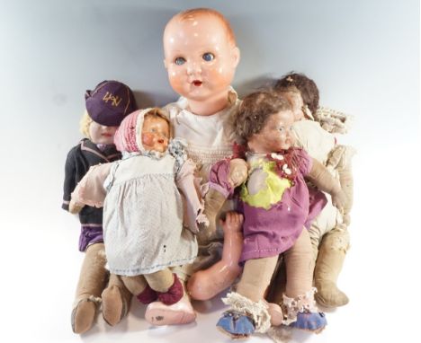 A group of vintage dolls, comprising a large Wilkinson &amp; Gross "Cinderella No 5" and four cloth bodied dolls, largest 64 