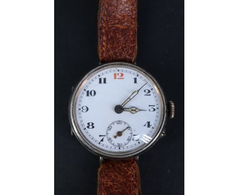 A Great War silver trench watch, having a Swiss pin-set movement and enamel face with "red 12", subsidiary seconds dial and l