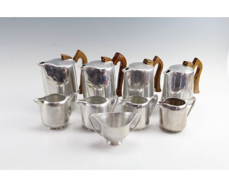 Four 1950s Picquot ware magnalium and teak coffee pots and four milk jugs, together with an associated sugar basin