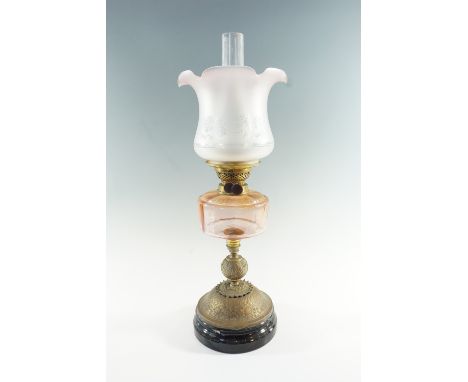 A Victorian and later brass and glass oil lamp, having a peach coloured font, a duplex coronet burner and etched achromatisin