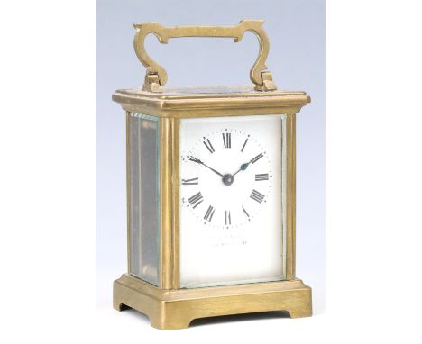 An early 20th Century brass carriage clock, retailed by 'Pearce and Sons Ltd, Leeds, York and Leicester', 8 x 6.5 x 12 cm wit