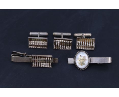 Hong Kong Sterling standard white metal cuff links, each in the form of an abacus, together with a matching tie clip and one 