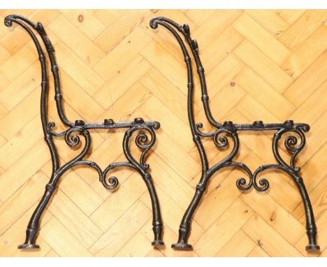 A pair of Victorian cast iron bench ends, 78 cm high