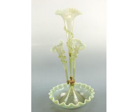An opaline glass epergne, the trumpet flutes having crinoline rims and applied trail decoration, lacking one flute, 52 cm 