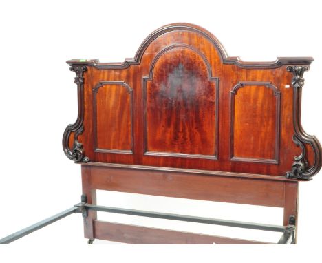 A 19th century Victorian flame mahogany double bed frame. The bed frame to include headboard and footboard. The headboard hav