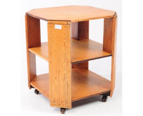 A 1930s Art Deco light oak Art Deco bookcase occasional table stand. Rectangular form with to under tiers all supports with c