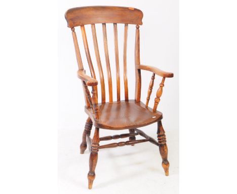 A Victorian 19th century country farmhouse Windsor beech and elm wood armchair. Slat highback rest with scrolled flat elbow r