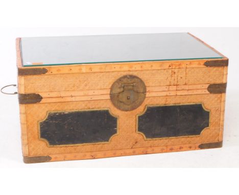 Late 20th century bamboo / cane work Chinese chest trunk. Rectangular form with drop in glass top, brass mounts, closing clas