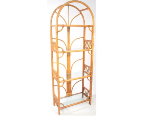 British Modern Design - 20th century bamboo and rattan weave open bookcase shelf. Arched top over a series of open shelves wi