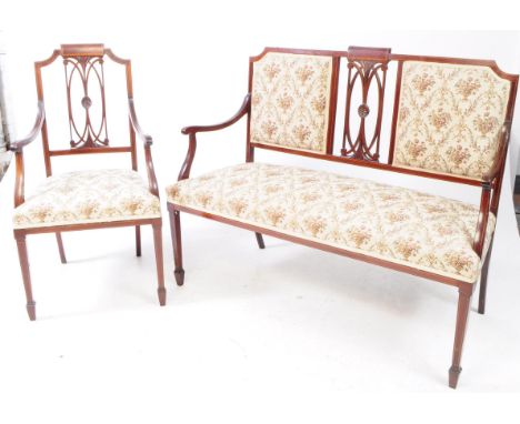 An Edwardian two piece mahogany salon parlour suite. Comprising of a two seater salon bench settee with marquetry inlay and m