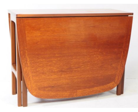 Nathan Furniture - A mid century teak drop leaf space saving gate dining table. Crossbanding top with two drop leaves, raised