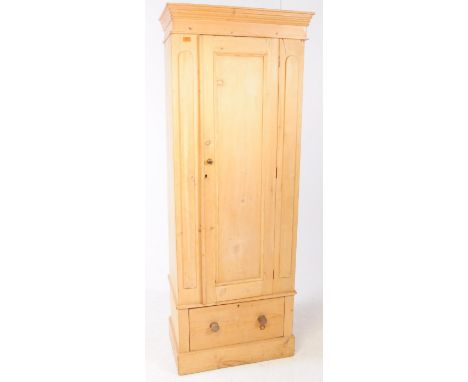 A Victorian 19th century pine single sentry box wardrobe. Having a pediment cornice to top with single door above a single pl