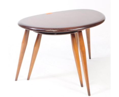 Ercol Furniture - Two mid 20th century circa 1960s Ercol dark beech and elm pebble (nest of) tables. Each having shaped table