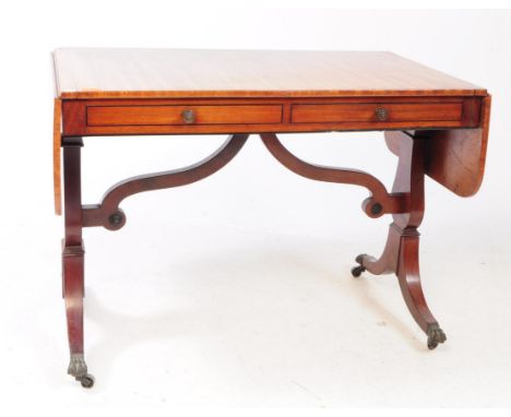 A George III early 19th-century mahogany sofa table - writing desk. Rectangular form with drop leaf extensions on either side
