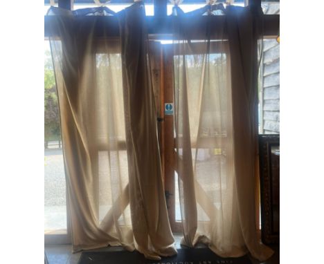 A pair of tall contemporary high-end design mixed cotton beige curtains drapes. Each curtain in sand colourway with a canvas 