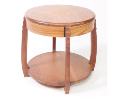 A vintage 20th century circa 1930s Art Deco oak circular occasional / coffee table. Panelled frieze being raised on shaped le