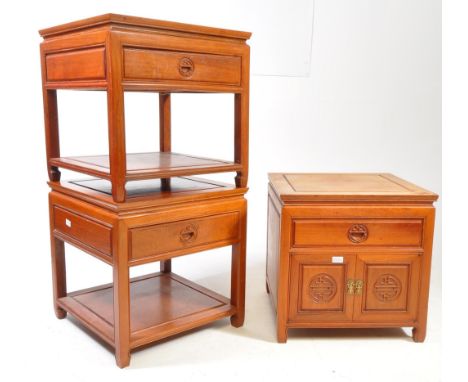 A pair of Chinese hardwood low bedside tables. Each raised on squared supports with lower tiers under single drawers set abov
