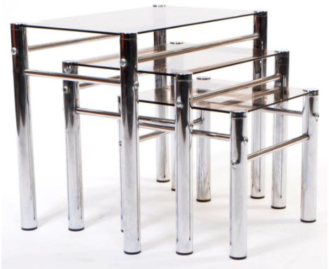 Italian Modern Design - Mid century Italian chrome and glass set of nesting tables. The nest of tables having tubular chrome 