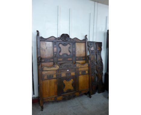 A 19th Century French provincial carved fruitwood double bed