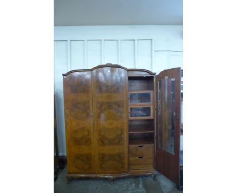 A burr walnut fitted three door wardrobe