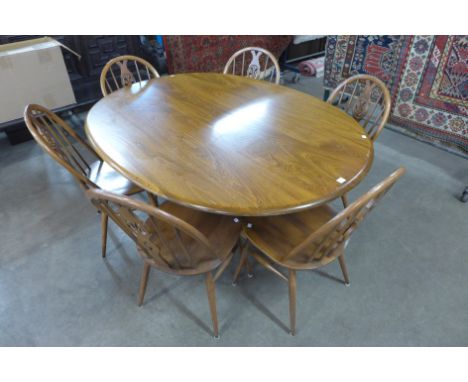 An Ercol oval dining table and six chairs 