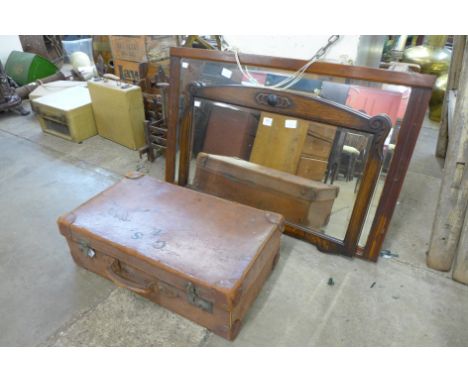 An Edward VII mahogany mirror, an oak mirror and a leather case