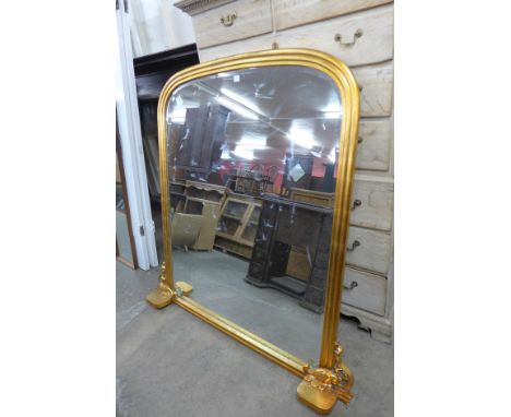 A gilt framed overmantel mirror