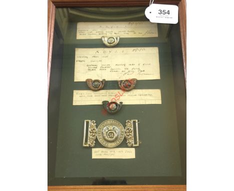 King's Own Yorkshire Light Infantry framed Officer's insignia. Patterns. Silvered and black enamel cap badge ...  brass, enam