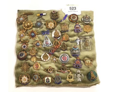 Selection of Regimental Brooches  An interesting selection mostly base metal & enamel, with some silver examples. Dating from