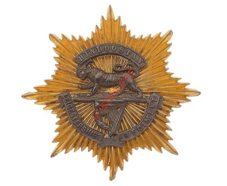 Leicestershire Regiment Victorian Officer's forage cap badge. A fine die-cast gilt star mounted with silver "Hindoostan" scro