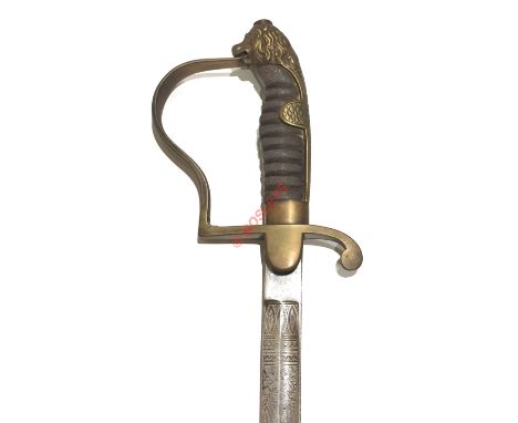 Imperial German Officer's Sword. This example with slightly curved single edged blade with etched decoration. The hilt with a