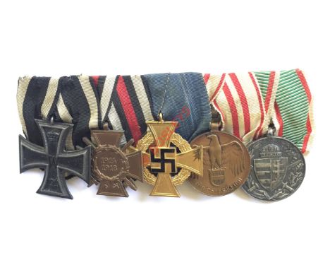 German Imperial and Third Reich Iron Cross group of five medals. A good group mounted as worn in the Germanic style. 1914 Iro