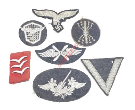 German Third Reich Luftwaffe assorted cloth badge. Early padded drop-tail breast eagle ... Flak personnel ... Transport drive