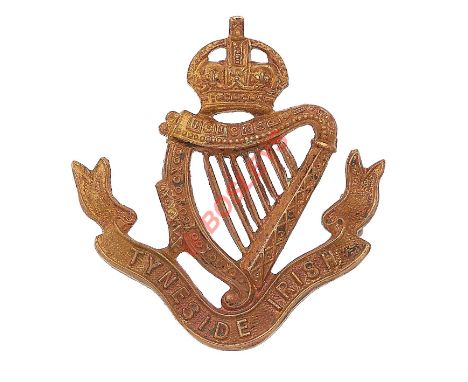 Tyneside Irish scarce first pattern brass shoulder strap badge by Reid. A good die-stamped example. Crowned harp on title scr