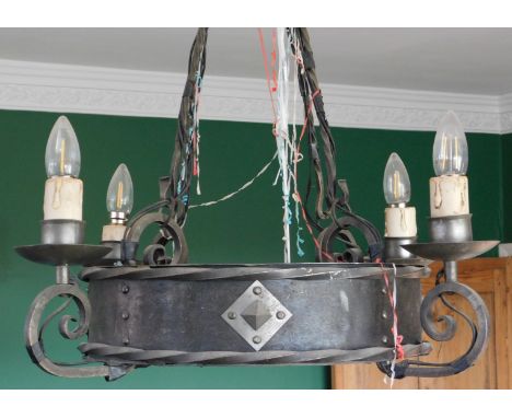 A heavy wrought iron four branch pendant light fitting, 66cm high.